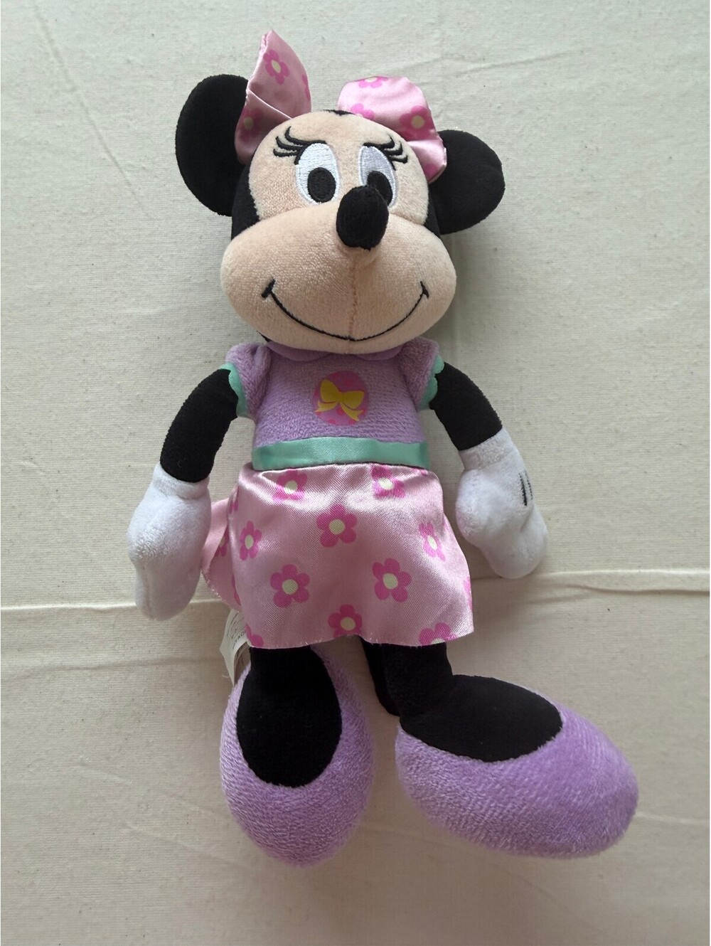 Disney Minnie Mouse plush toy in pink and purple outfit